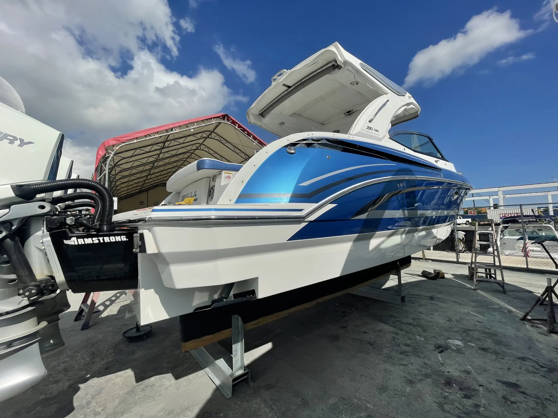 Formula 330 CBR stern and swim platform showing a glossy blue graphics finish