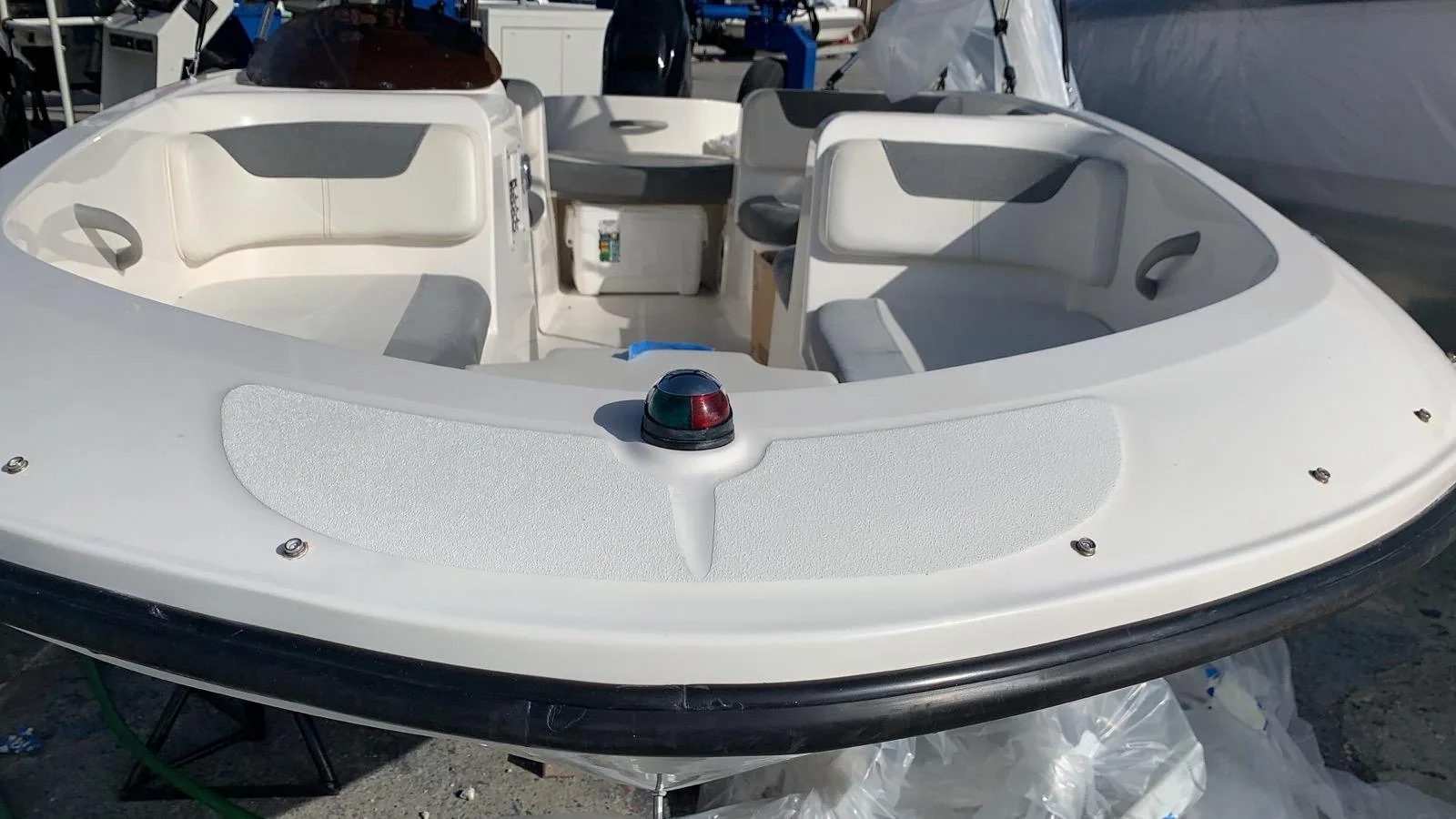 Finished white bow rider cockpit and bow deck with clean gelcoat and seating